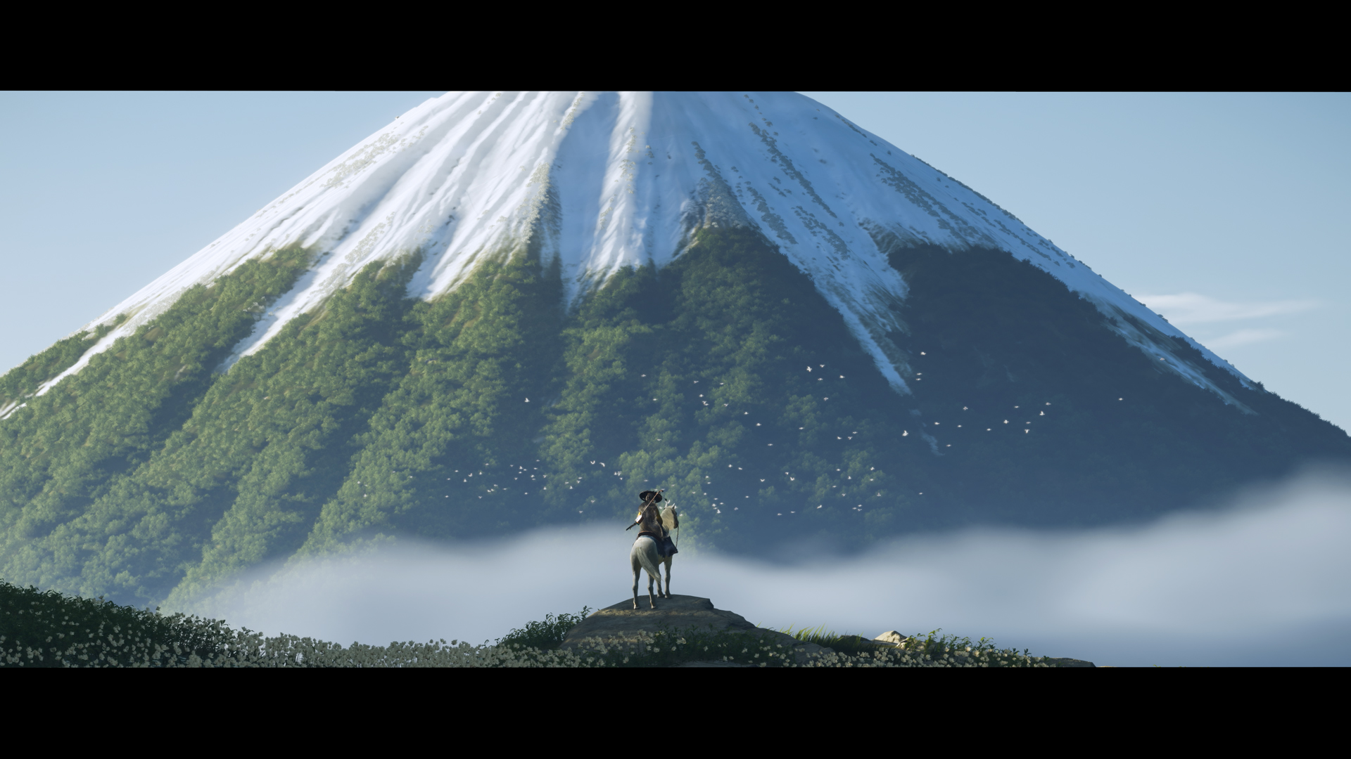 Atsu on horseback in front of a vista of Mt Yotei from Ghost of Yotei