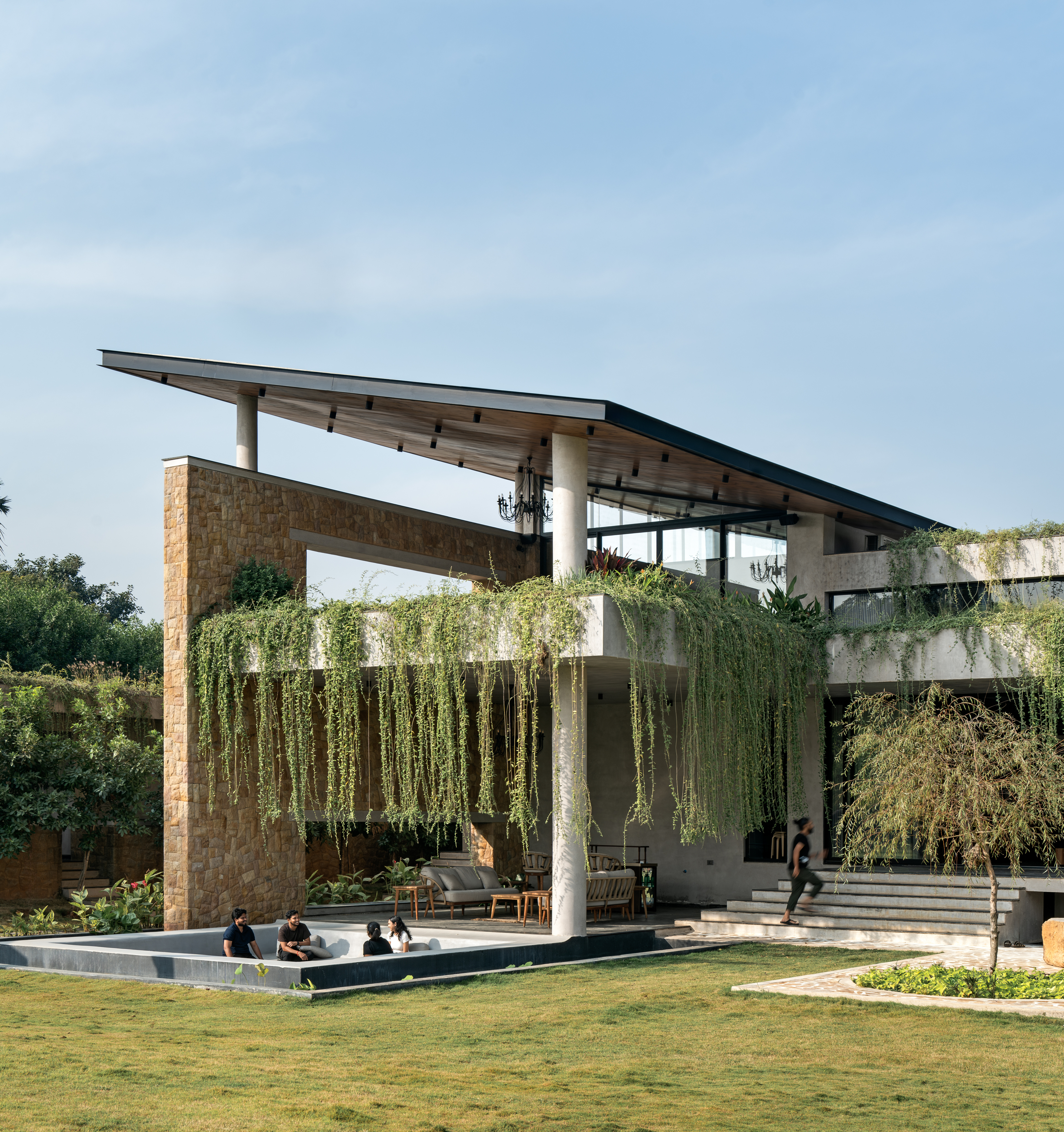 hyderabad home in brutalist style covered in greenery by 23 Degrees Design Shift
