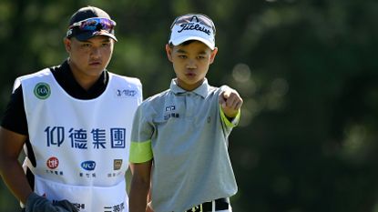  Hsieh Cheng-wei lining up a putt at an Asian Tour event