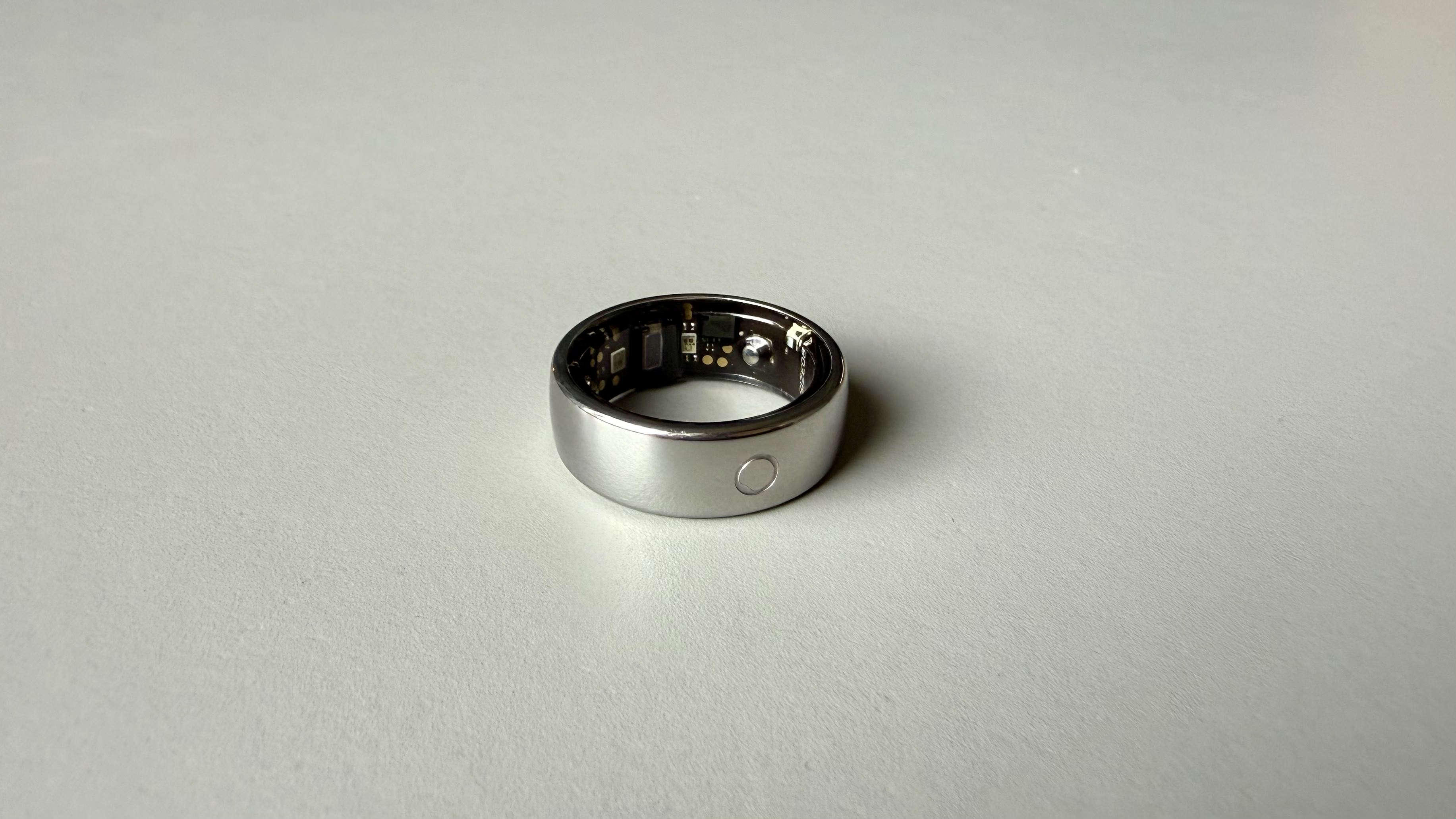 The circular ring 2 smart ring pictured on a grey surface