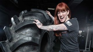 Walls Of Jericho's Candace pushing a tractor tyre