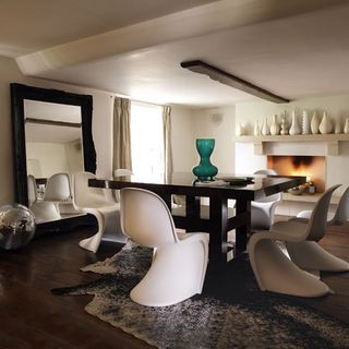Living room wooden flooring and dinning table with chairs