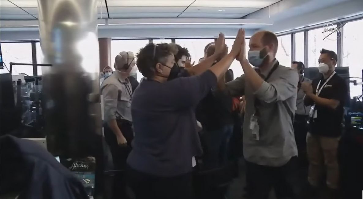 The mission operations team of NASA's James Webb Space Telescope cheers as the huge observatory unfolded its final mirror segments into place to complete its deployment on Jan. 8, 2022.
