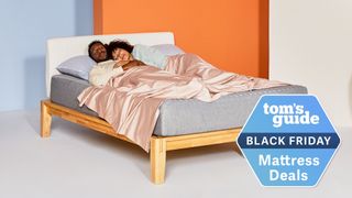 The Siena Memory Foam Mattress placed on a light wooden bedframe in an orange bedroom with a Black Friday mattress deals badge overlaid in blue