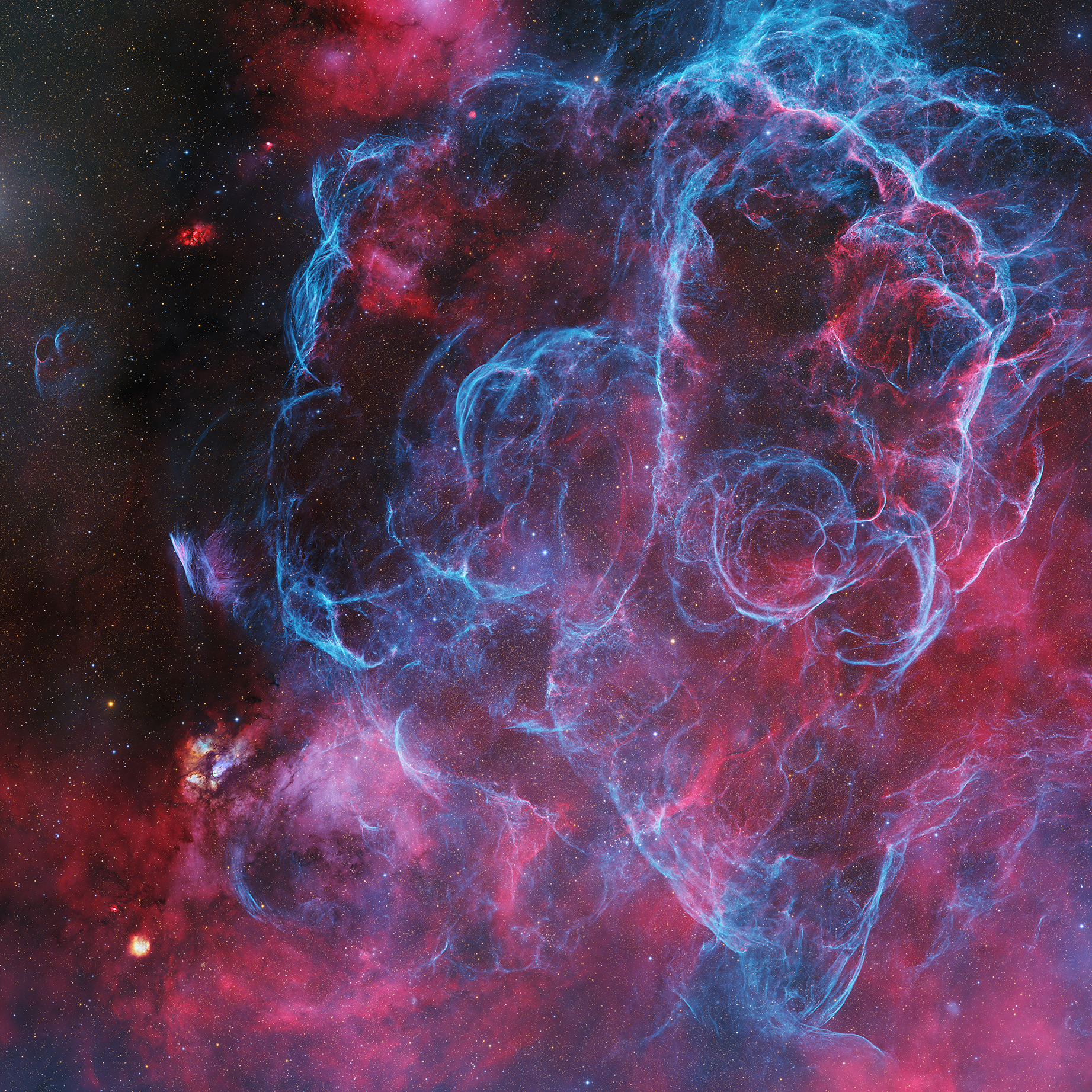 A vibrant cosmic scene with wispy blue and pink nebula clouds swirling against a dark starry background, conveying a sense of mystery and wonder
