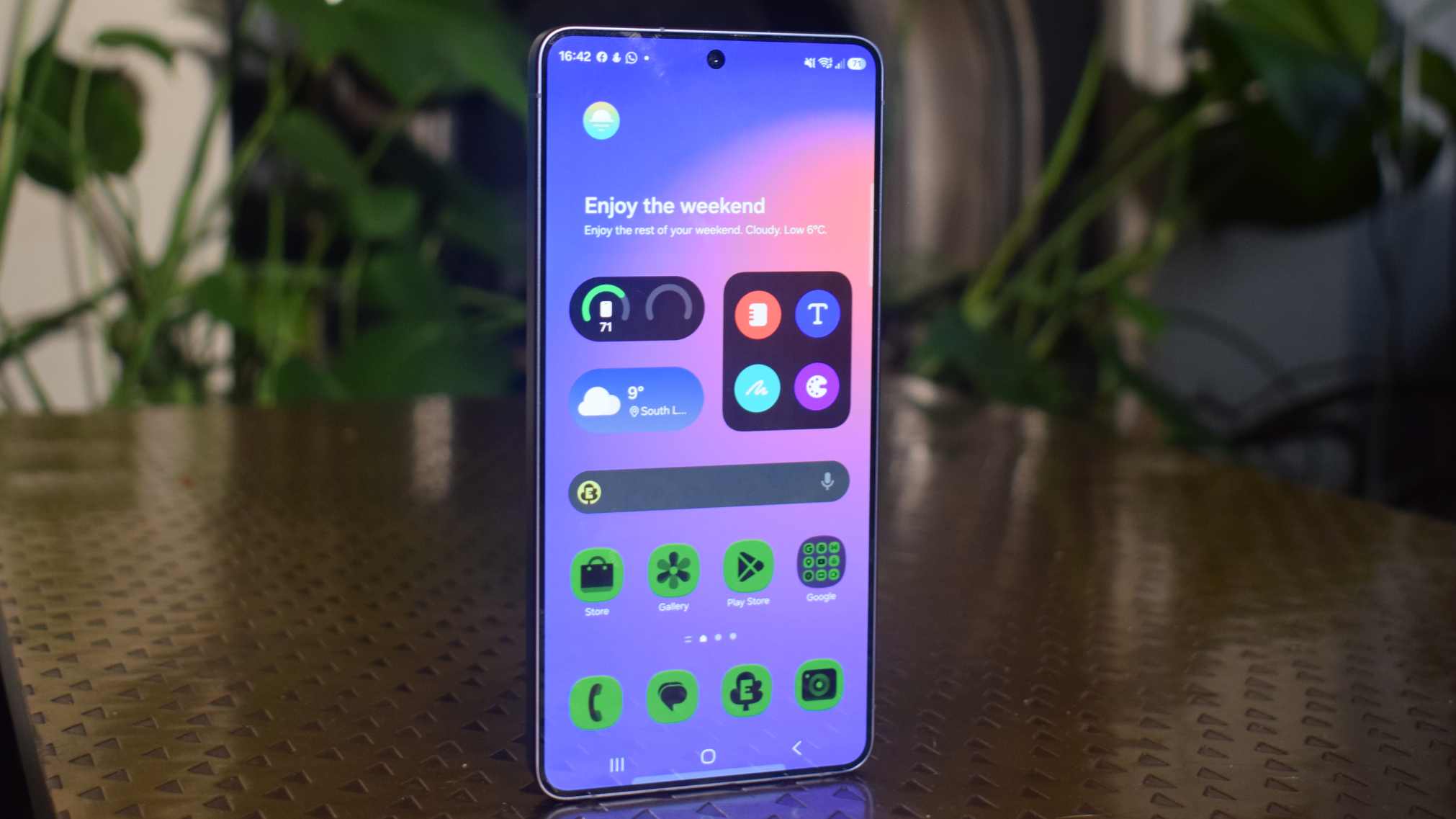 The Samsung Galaxy S26 Ultra standing up on a table, showing its main menu.