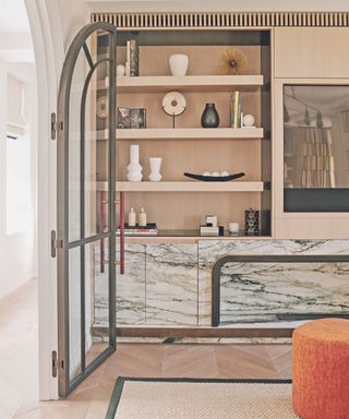 Living room storage in alcove with marble