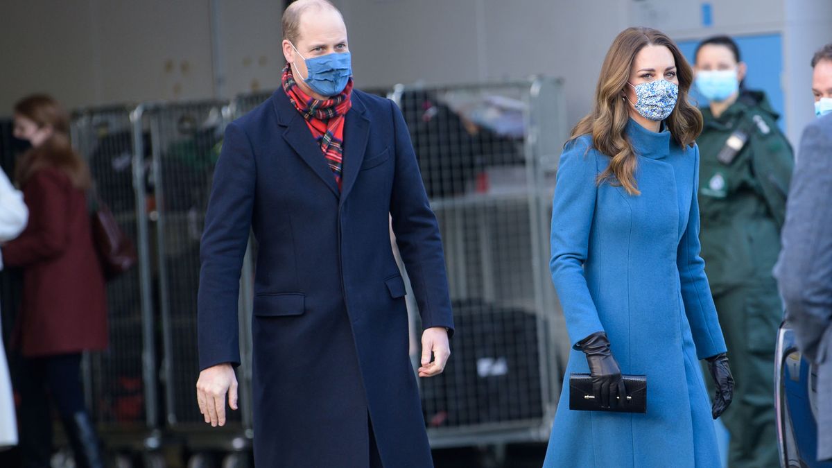 kate carrying strathberry in navy (picture of black clutch also owned by  kate)
