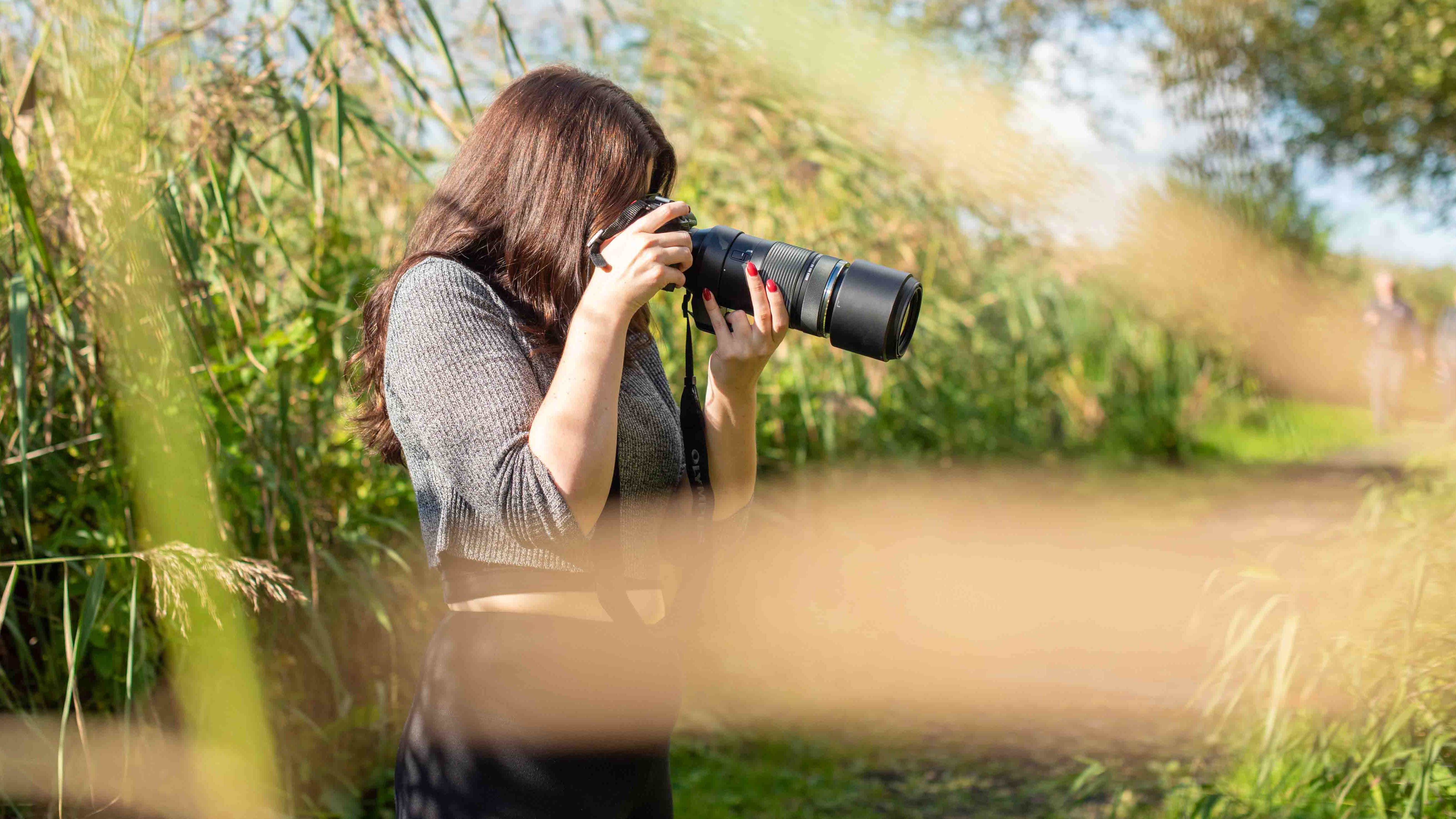 author shooting with the OM-1 Mark II at a nature reserve