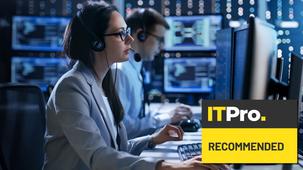 woman and man working in tech support in an IT control room