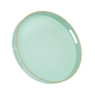 A circular mint green tray