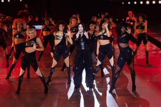 cher performs with a group of dancers at the victoria's secret fashion show