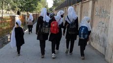 Girls in Afghanistan walk to school.
