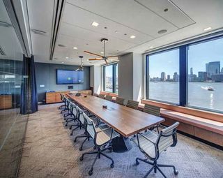 This 16-seat boardroom makes use of flush-mounted Audix M70 ceiling mics to meet the aesthetics demanded by this financial software services company.