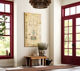 White entry way with red doorways and windows