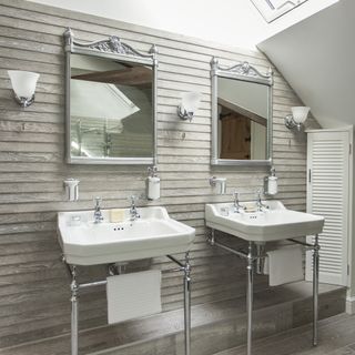 bathroom with two mirrors and basin