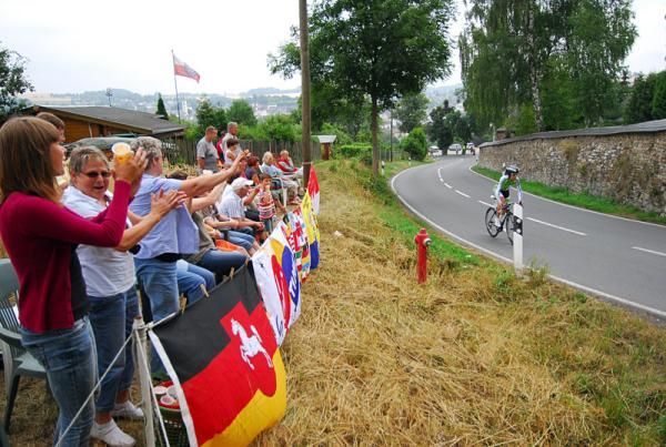Spectators cheer on the riders during the stage four time trial.
