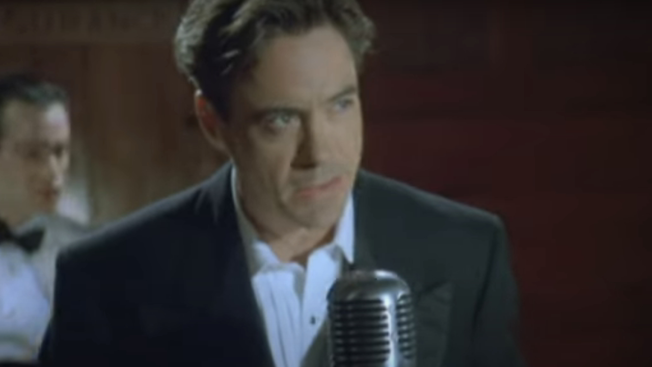 Robert Downey Jr. performing in front a microphone in The Singing Detective