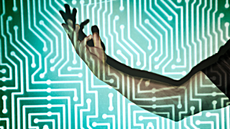 Hand in the middle of microchip light projection.