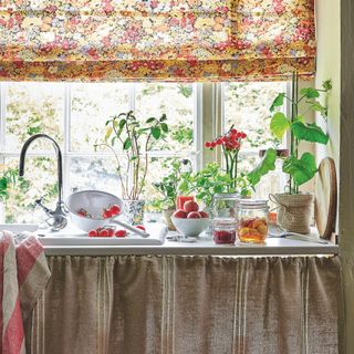 kitchen sink with valance curtain and floral blind