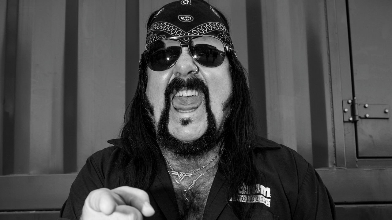 A press shot of Vinnie Paul pointing at the camera