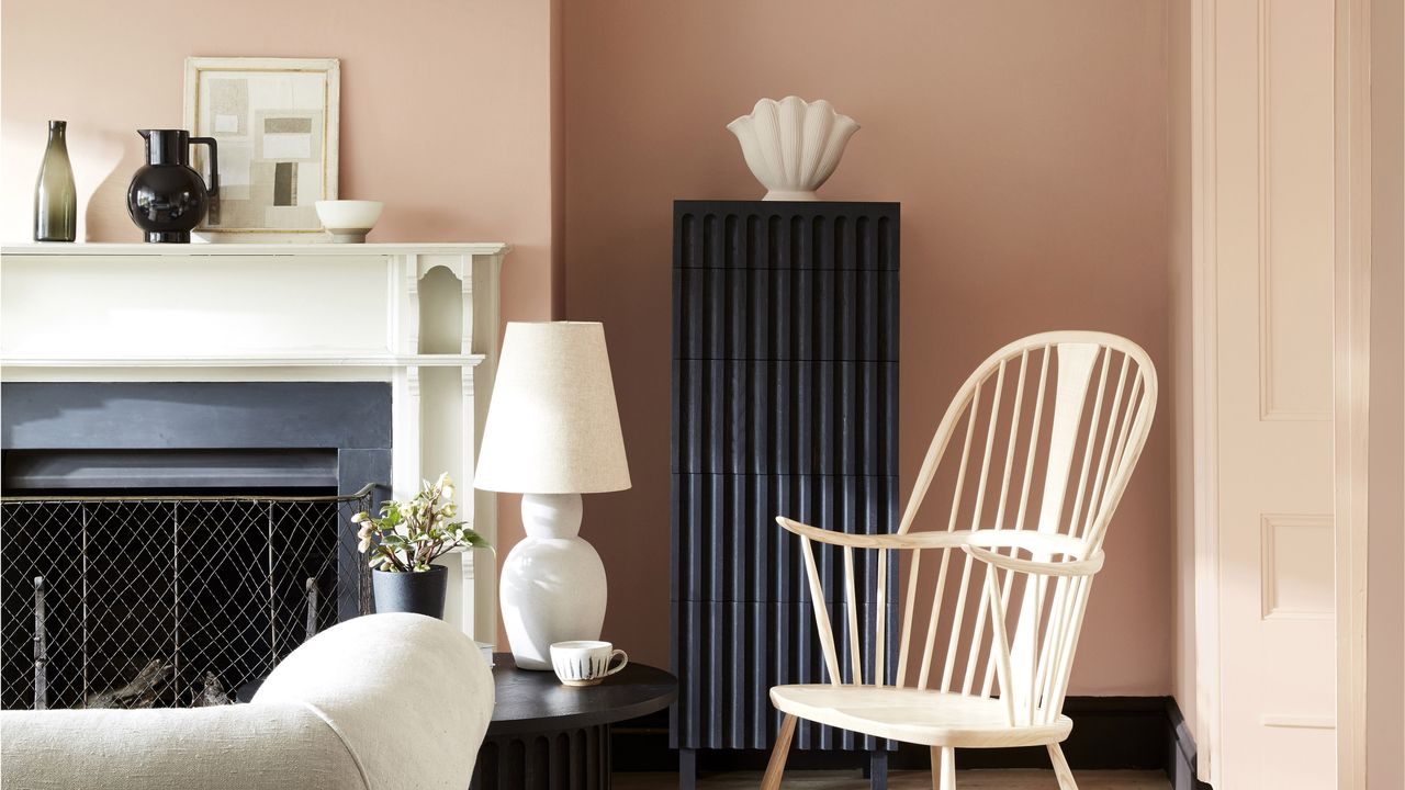 Pink painted room with black and white accessories