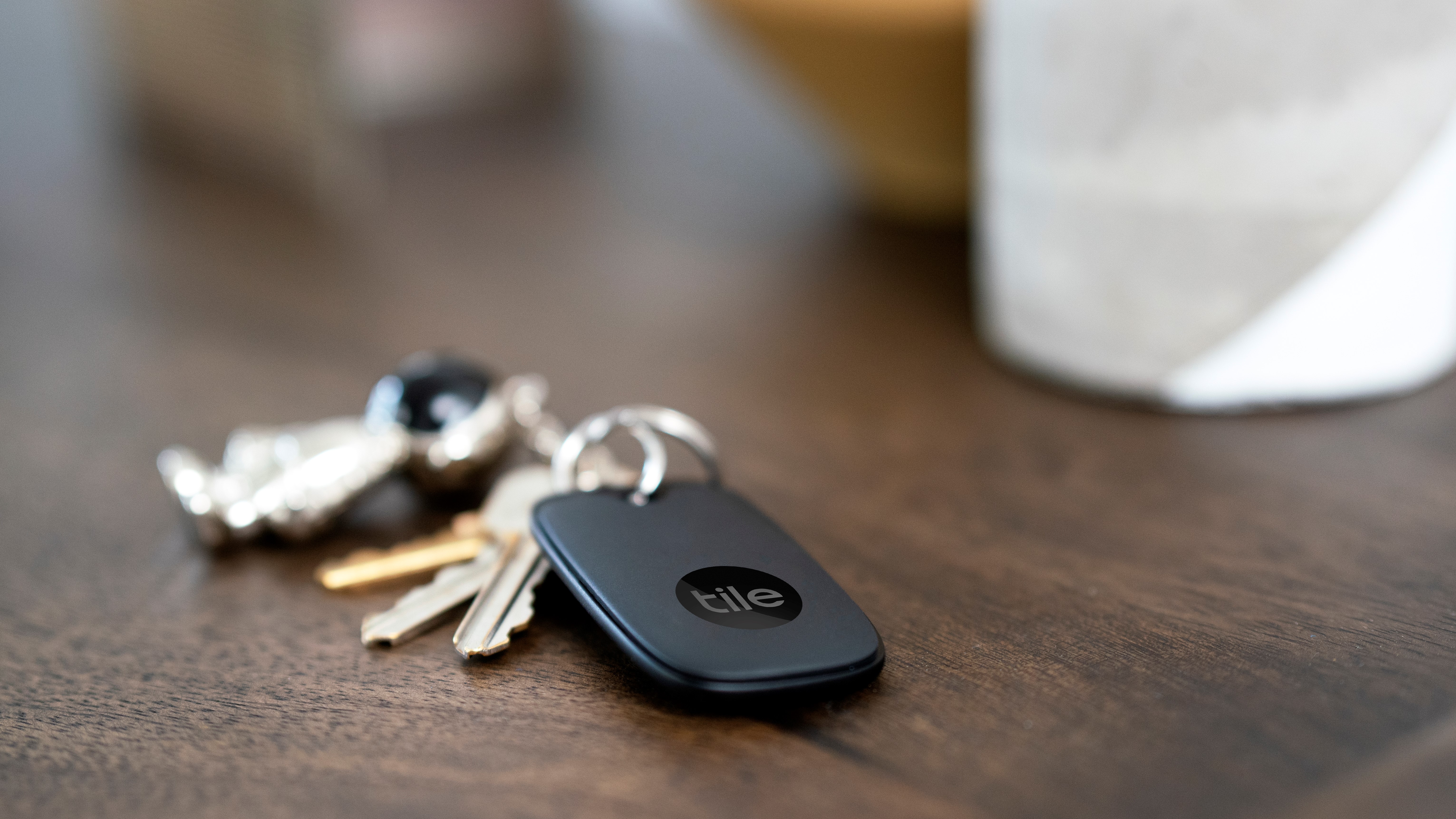 The Tile Pro (2021) attached to keys on a desk