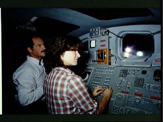 Astronauts Sally Ride and Frederick Hauck train for STS-7 mission.