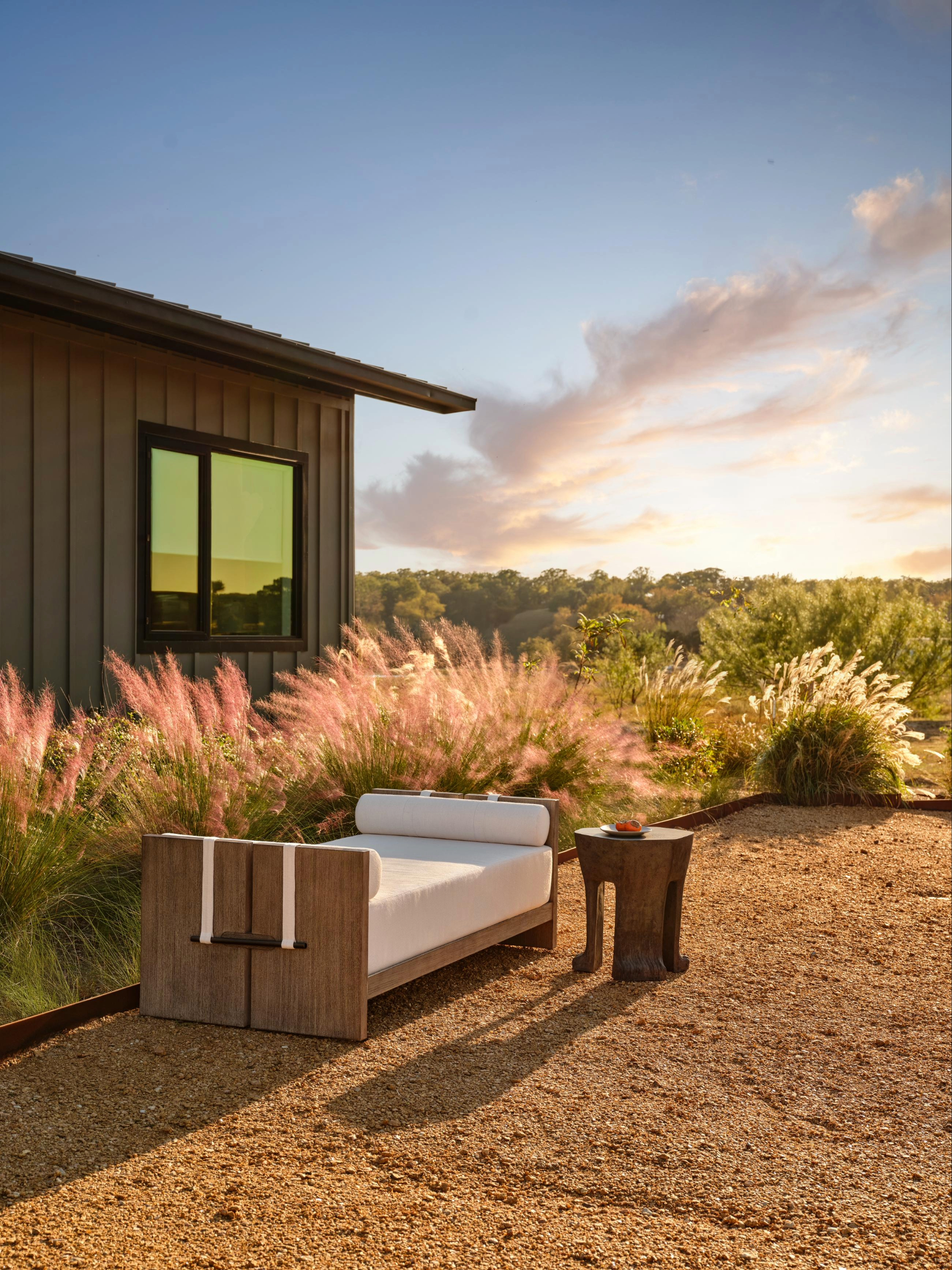 Outdoor daybed upholstered in cream boucle