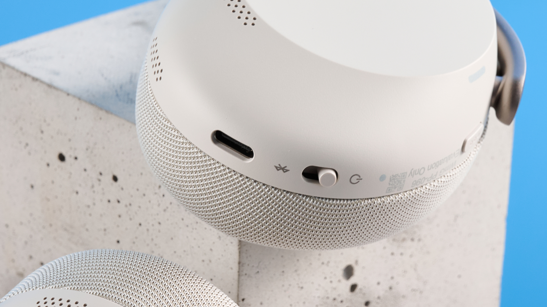 Jabras Evolve3 75 conferencing headset on a stone surface with a blue background