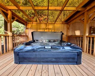 hydrolife hot tub with wooden shelter