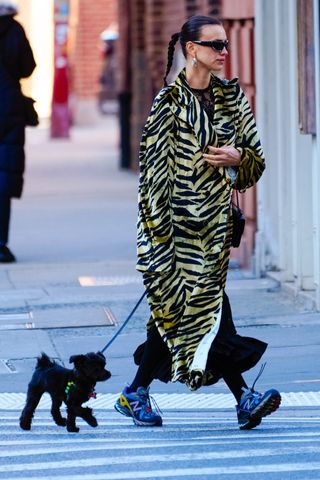Irina Shayk New Balance sneakers Hermes bag Margiela Gentle Monster sunglasses tiger print coat