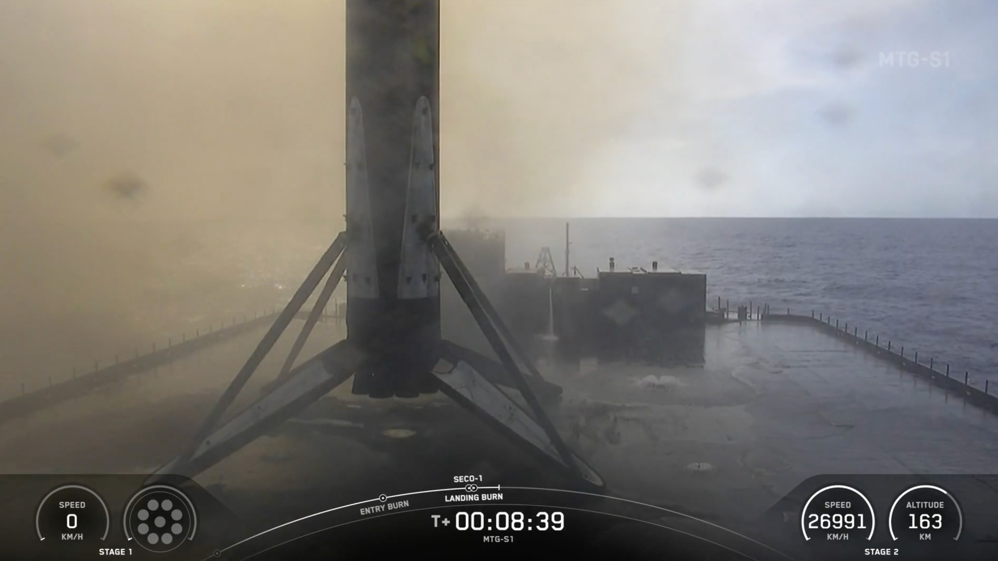 a rocket rests on the deck of a ship at sea