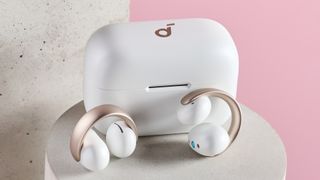 Anker Soundcore AeroClip on ear headphones positioned in front of their charging case