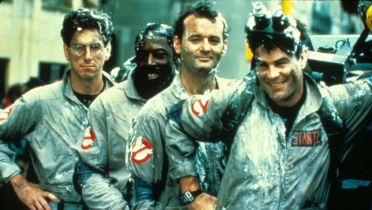 A promotional image for 1984's Ghostbusters showing the four main stars