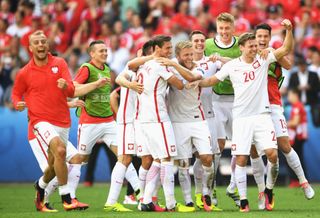 Poland players celebrate their Euro 2016 penalty shootout win over Switzerland.