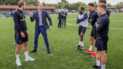 Britain's Prince William, Duke of Cambridge (C), President of the Football Association speaks with England football players