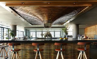 Close up of bar with large wicker feature on ceiling