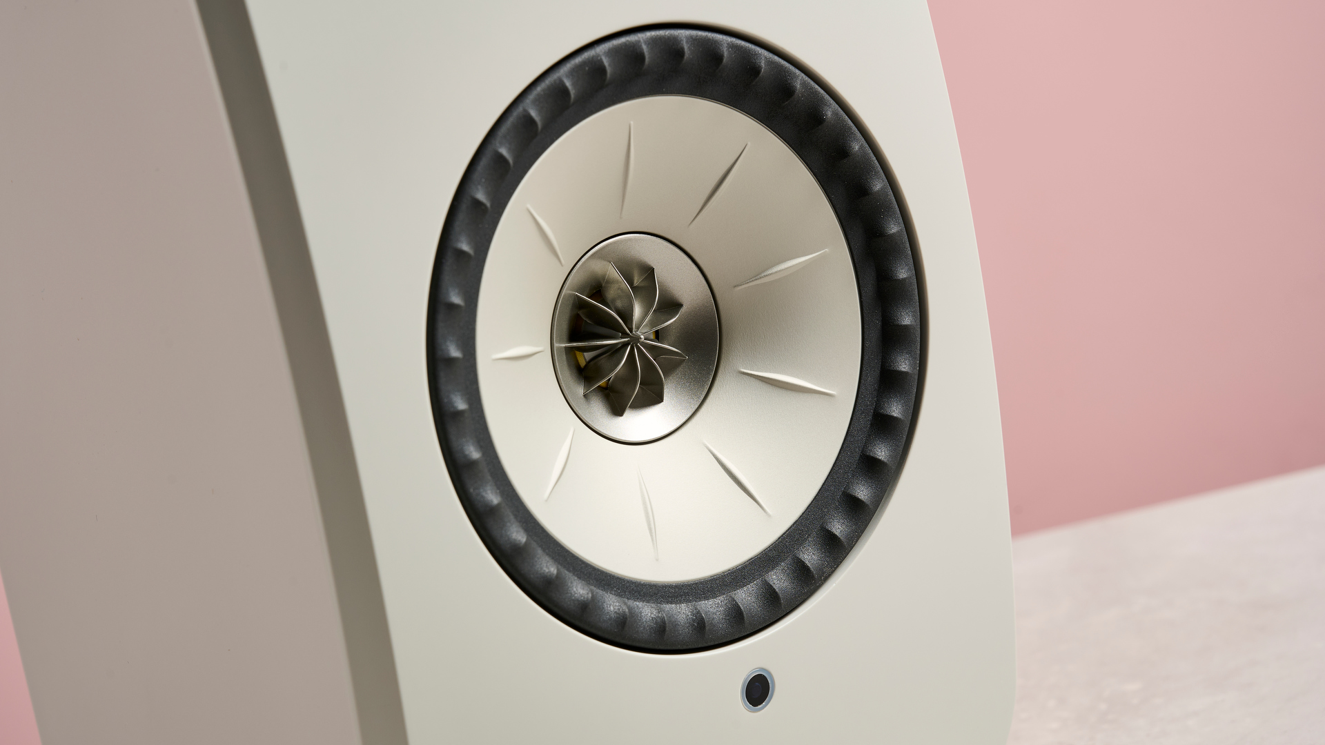 The KEF LSX II LT speaker against a pink background showing the Uni-Q drivers