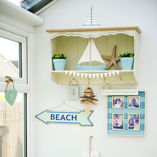 white wall with craft boat and shelf