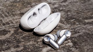 Beyerdynamic Amiron 100 out of the case, on a wooden surface