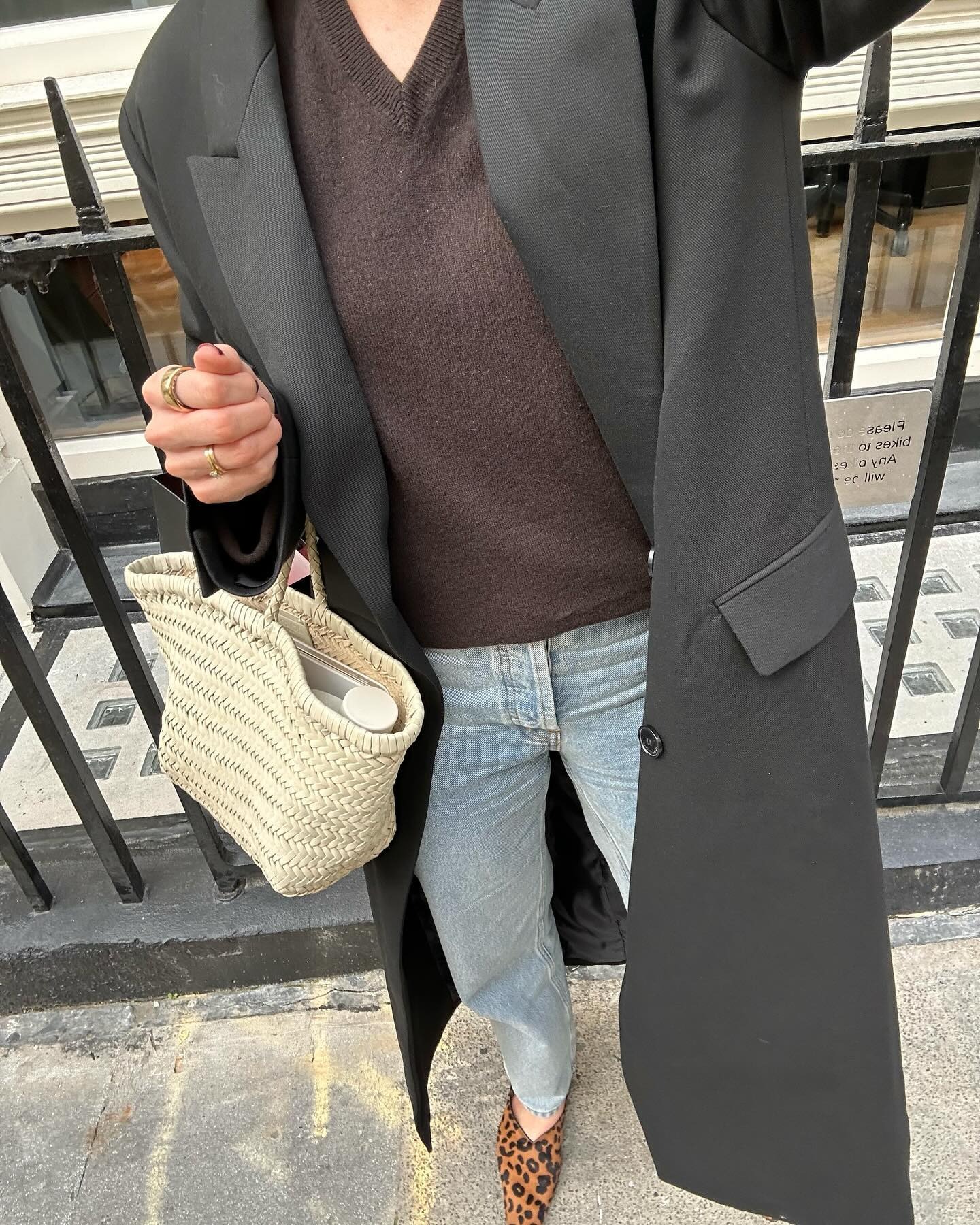 A woman showing how to style ballet flats with cigarette jeans.