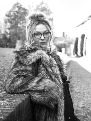 Hasselblad XCD 75P sample image of a woman wearing a fur coat in an urban environment