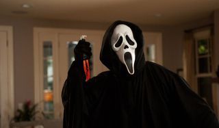 Scream Ghostface holding a bloody knife in its' hands