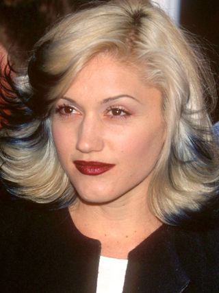 Gwen Stefani in the '90s wearing dark red lipstick.