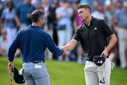 Ludvig Aberg shakes Rory McIlroy's hand after playing together at Wentworth