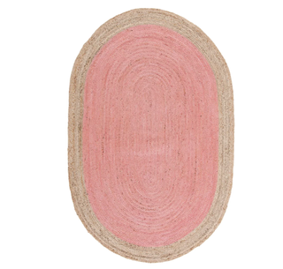 A pink round jute rug