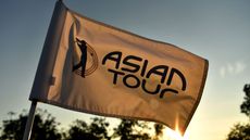 An Asian Tour flag blows in the wind