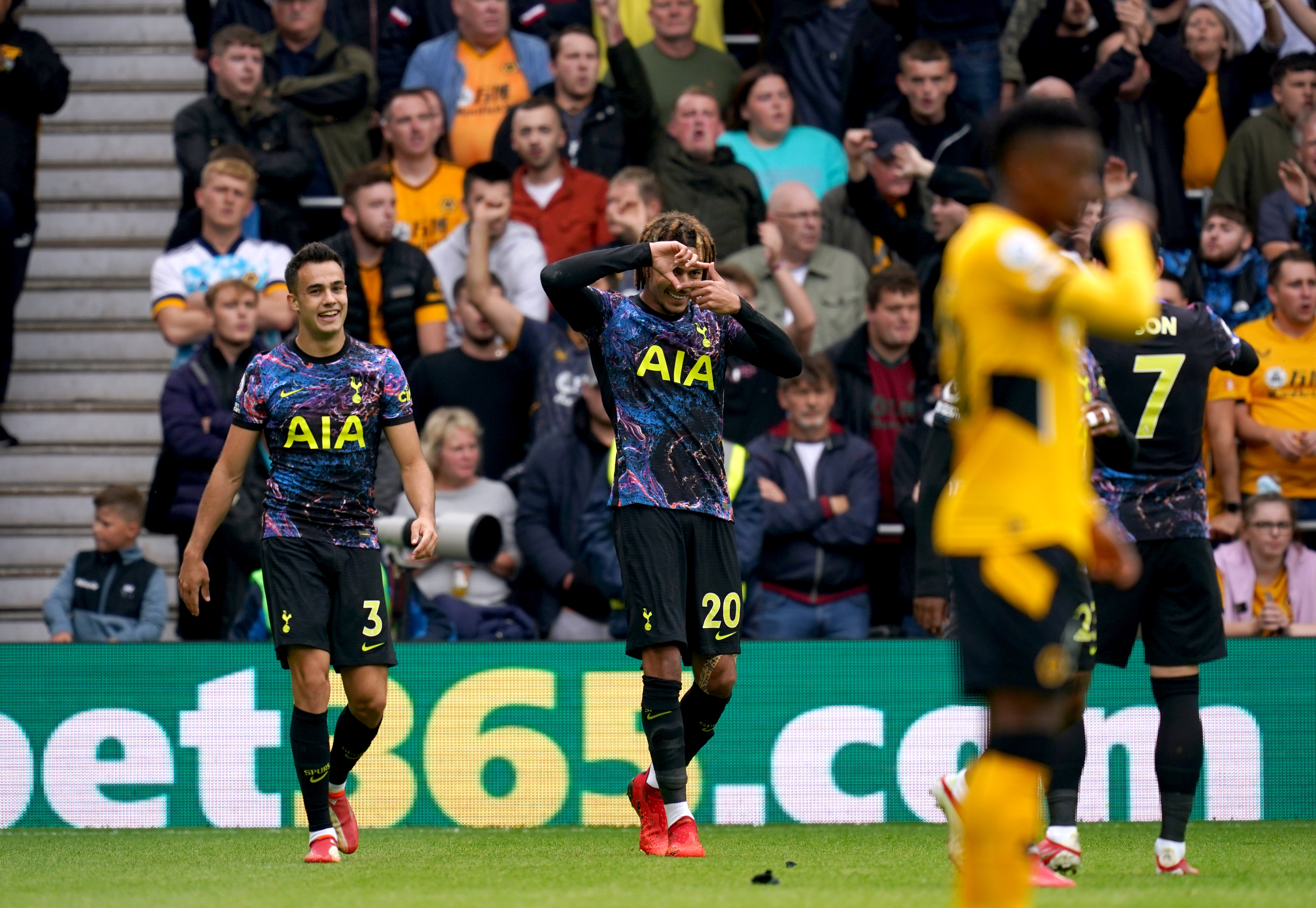 Dele Alli (centre) celebrates scoring