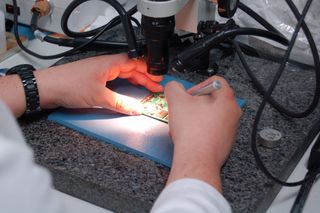 Removing memory chips from a SSD with the aid of a microscope